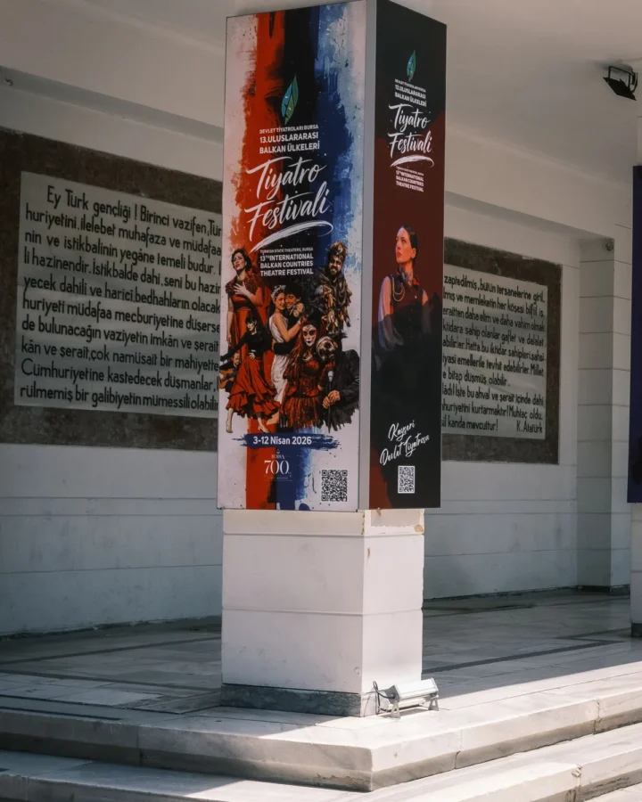 Tall printed display banner at a venue entrance