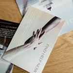 Folded printed brochure on a wooden desk