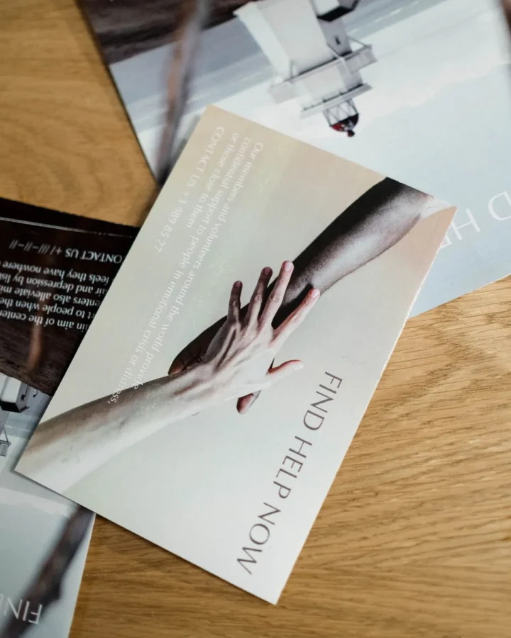 Folded printed brochure on a wooden desk