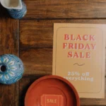 Printed Black Friday sale flyer on a wooden table