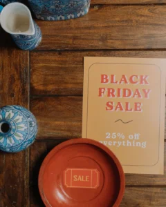 Printed Black Friday sale flyer on a wooden table