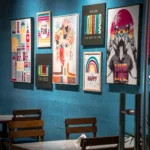 Colourful printed posters on a cafe wall