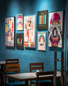 Colourful printed posters on a cafe wall