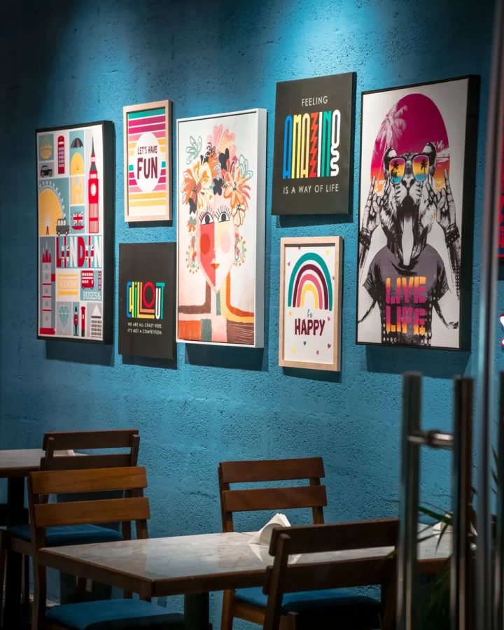 Colourful printed posters on a cafe wall